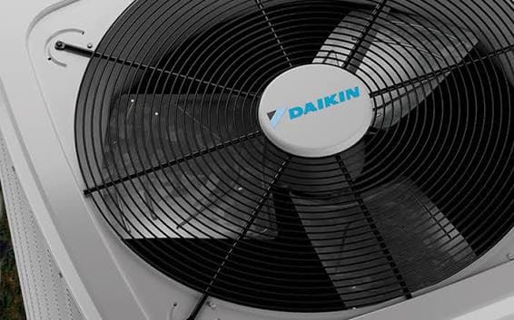 Close-up of an outdoor condenser unit fan